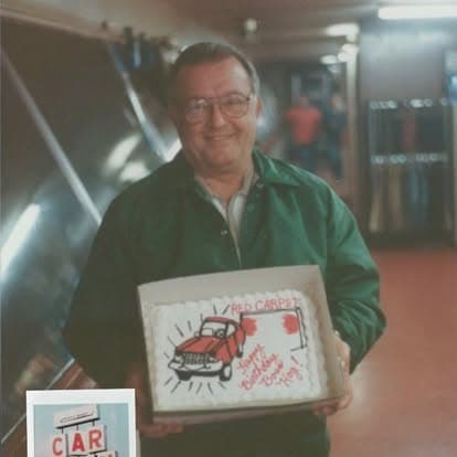 A framed photograph of the original delivery truck, held with pride