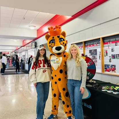 The Cheetah Clean mascot greeting a customer
